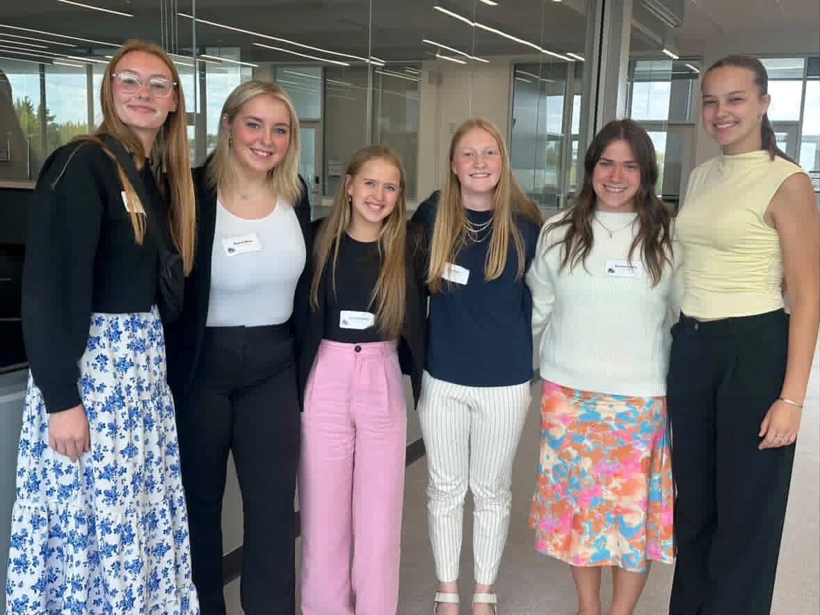 South Dakota FBLA: members in professional dress posing together