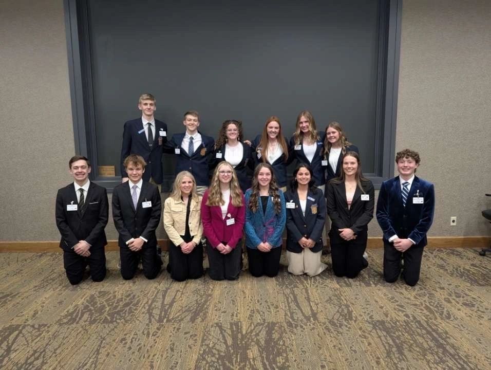 South Dakota FBLA students posing for a group photo on stage